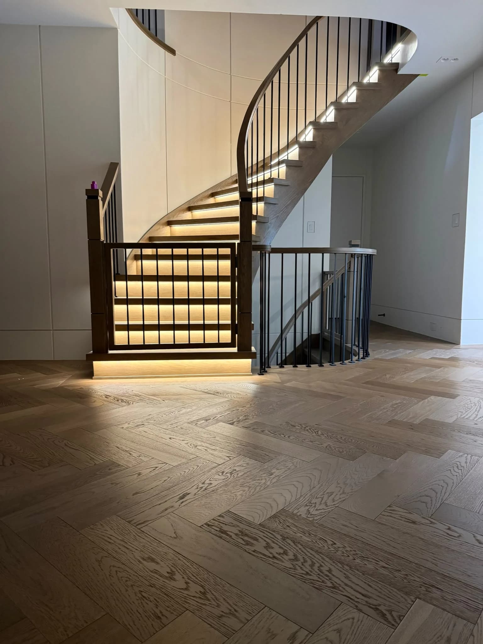 Curved Floating Staircase with LED Lighting: A Windsor Project