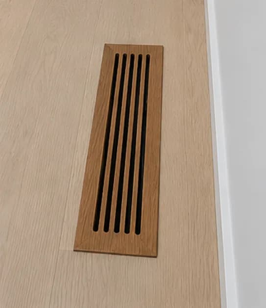 Tall narrow vertical wooden vent register for baseboard installation